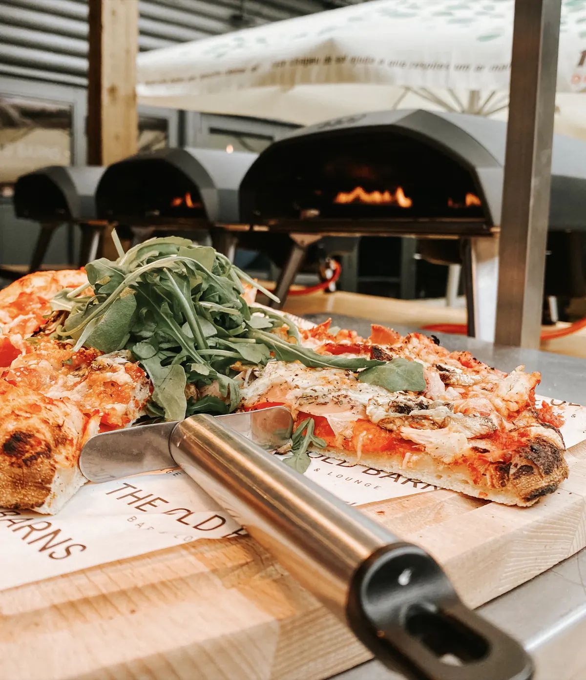 The courtyard, with outdoor pizza ovens and parasols